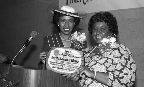 Alpha Phi Zeta Chapter, Zeta Phi Beta Sorority sister presenting Deborah P. Wolfe with an award, Los Angeles, 1989