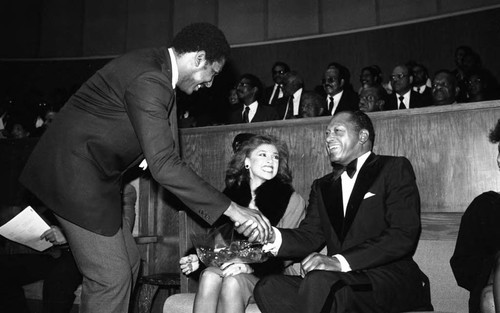 Tom Bradley shaking hands with Willis Edwards with during the NAACP 75th anniversary kick-off celebration, Los Angeles, 1984