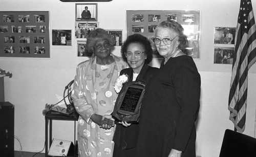 Rita Walters holding her Estelle Van Meter Community Leadership Award, Los Angeles, 1989