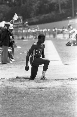 Carl Lewis completing a long jump, Los Angeles, 1982