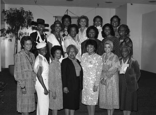 Alpha Gamma Omega forum participants posing together, Los Angeles, 1985