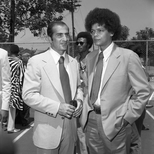 Bob Moretti talking with Julian Bond, Los Angeles, 1974