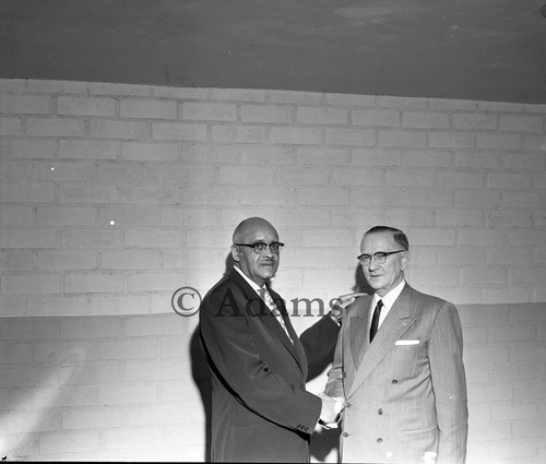 Men shake hands, Los Angeles, 1955