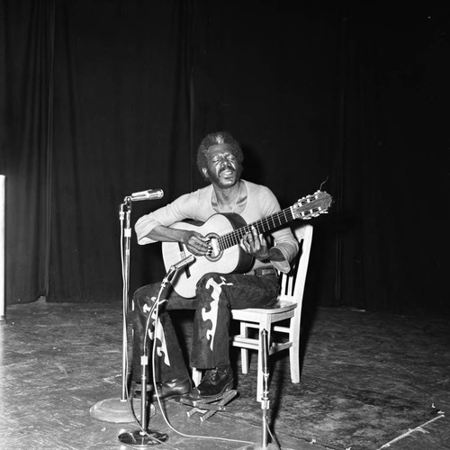 Man performs on stage, Los Angeles, 1972