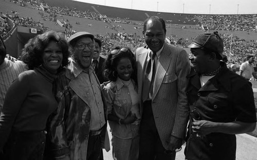 Redd Foxx,Tom Bradley, and Flip Wilson posing with others during the Urban League's Freedom Classic, Los Angeles, 1973