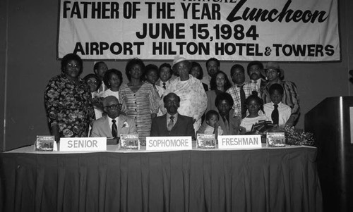 Father of the Year honorees posing with their families and others, Los Angeles, 1984