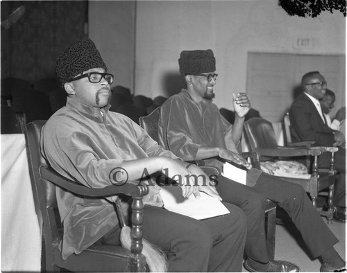 Ron Karenga sitting with Hakim Jamal, Los Angeles, 1966