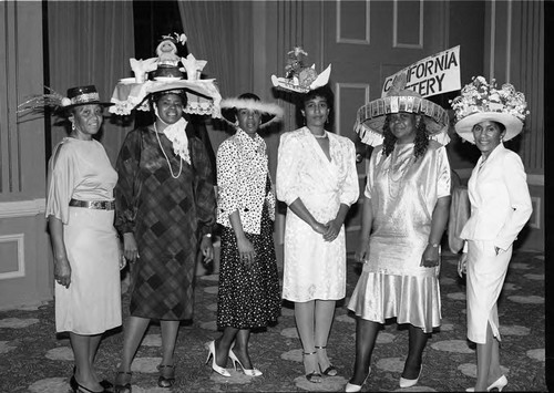 Six women wearing homemade hats at Dental Society event, Los Angeles, 1986