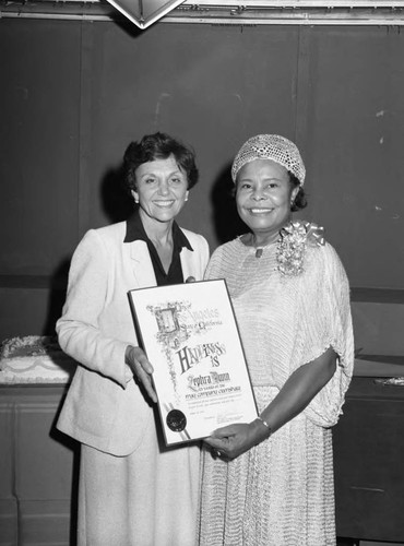 Zephra Dunn receiving a commendation from Pat Russell, Los Angeles, 1983