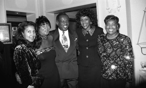 Lou Rawls posing with participants in the "Lou Rawls Parade of Stars" telethon, Los Angeles, 1994