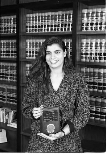 Cynthia Koga holding her Compton Judicial District Employee of the Quarter award, Los Angeles, 1991