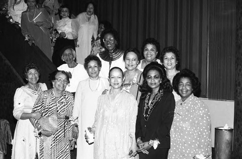 Women posing together during the Ebony Fashion Fair, Los Angeles, 1984