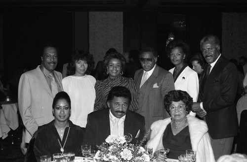 Guy and Patricia Crowder posing with others at the Bohana 50th wedding anniversary celebration, Los Angeles, 1984