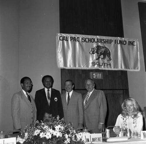 August Busch, III and Mel Elliot posing with others at the 9th annual Cal-Pac Scholarship Fund awards banquet, Los Angeles, 1982