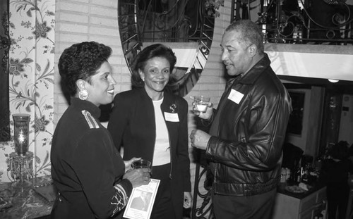 Guests talking together at an event hosting Judge Reginald A. Dunn, Los Angeles, 1996