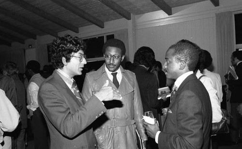 Peter Nazareth talking with others at a UCLA conference on Black literature, Los Angeles, 1983