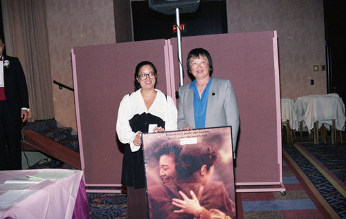 Asian Pacific American Legal Center event participants holding a poster, Los Angeles, ca. 1989