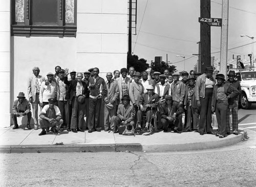 Men posing in front of the Dunbar Historical Black Museum, Los Angeles, 1983