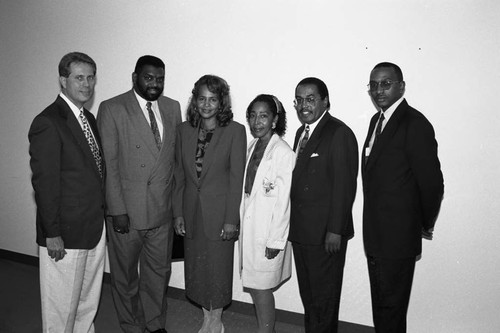 Business conference participants posing together, Los Angeles, 1994