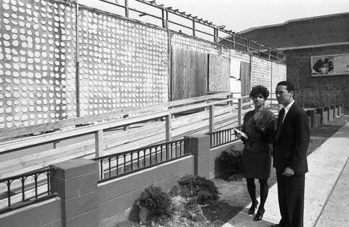 Paul C. Hudson examining Broadway Federal Savings and Loan headquarters construction, Los Angeles, 1992