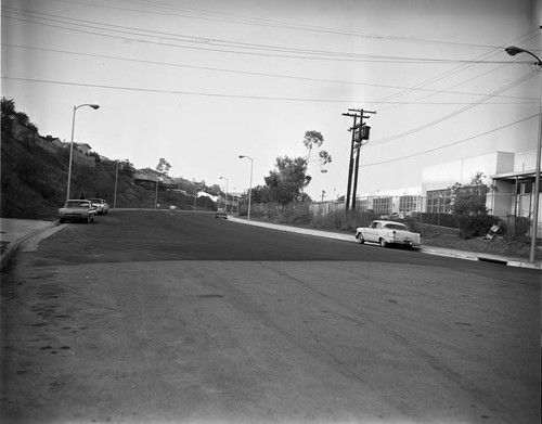 Automobiles parked along hillside, Los Angeles, 1963