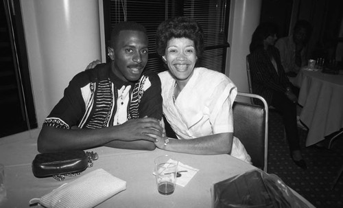 Couple posing together at the Urbanites 11th annual "Games People Play" event, Los Angeles, 1991