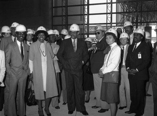 David S. Cunningham, Jr. posing with others at a construction site., Los Angeles, 1984