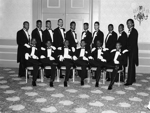 Phi Delta Kappa debutante escorts posing together, Los Angeles, 1987