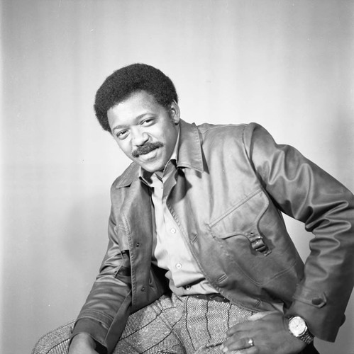 Guy Crowder posing in the studio for self-portrait, Los Angeles