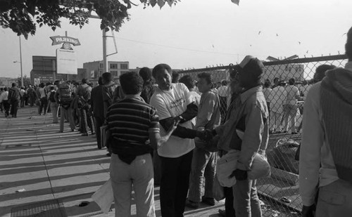 People lining up for a meal from Upper Room Christian Church, Los Angeles, 1986