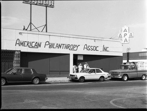 Men and women gathering in front of the American Philanthropy Association building, Los Angeles, 1984