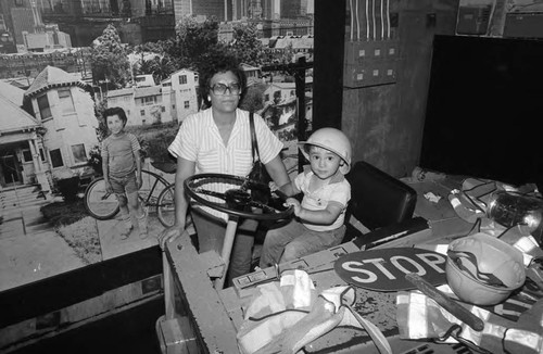 Children's Museum toddler sitting in a vehicle, Los Angeles, 1986