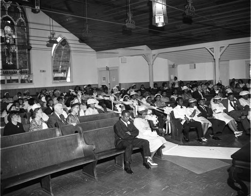 Wedding guests in a church, Los Angeles, 1962