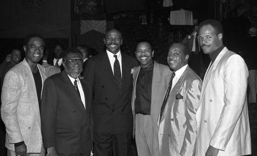 Guests of the "Harlem Suite" musical benefit performance posing together, Los Angeles, 1989