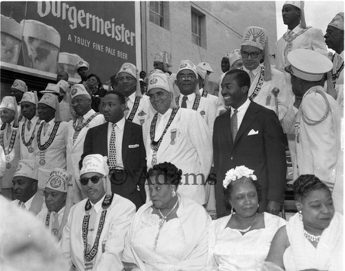 Rev. Dr. Martin Luther King Jr. posing with Hobson R. Reynolds and others, Los Angeles, 1956