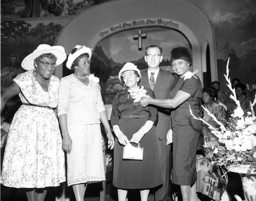 Bethune Women's Day coordinators and guests posing together at Second Baptist Church, Los Angeles, 1962