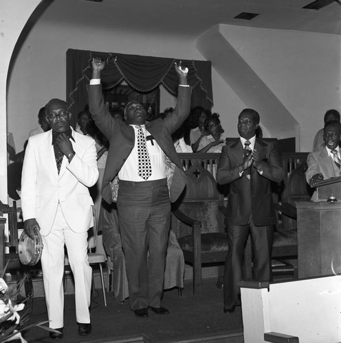 Bishop Barnes church service participants responding to his sermon, Los Angeles, 1976