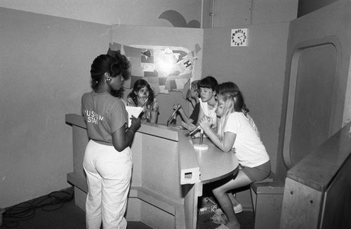 Children's Museum visitors participating in an exhibit, Los Angeles, 1986