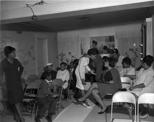 Bride talking with a guest at her wedding, Los Angeles, 1965