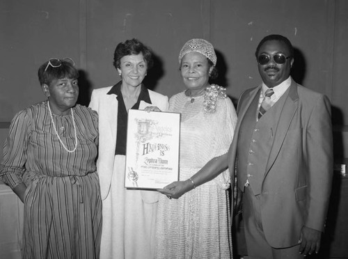 Zephra Dunn receiving a commendation from Pat Russell, Los Angeles, 1983