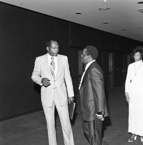 Tom Bradley talking with Lee Elder during an event in his honor, Los Angeles, 1977