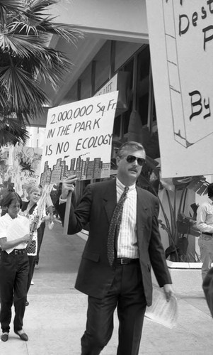 Man picketing in front of a Soka Gakkai International exhibition, Los Angeles, 1993