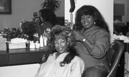 Baby Doll's Hair Design beautician with a client, Los Angeles, 1989