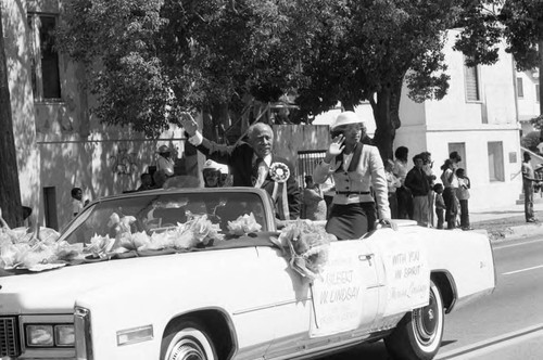 Gilbert Lindsay and his granddaughter riding in the 16th annual Easter parade, South Central Los Angeles, 1984