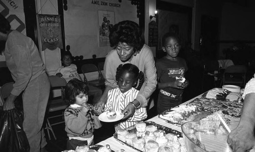 Children attending a holiday party for crime victim families, Los Angeles, 1986