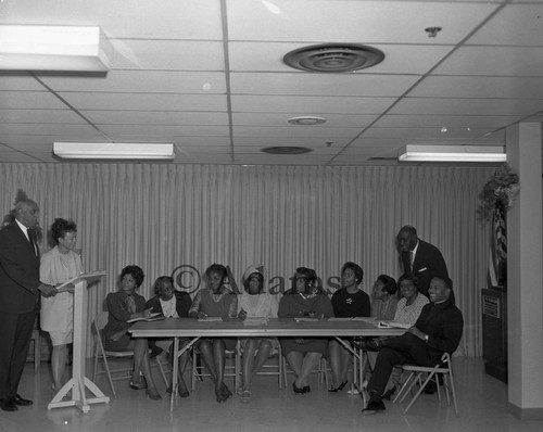 Men and women at table, Los Angeles, 1969