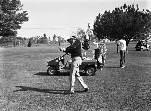 Joe Solomon playing golf, Los Angeles, California, 1983