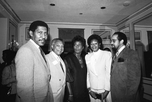 Willis Edwards, John Mack, Madge Sinclair, and John T. MacDonald, III posing together, Los Angeles, 1984