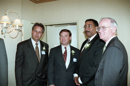 Willie Williams posing with others at an event to welcome him, Los Angeles, 1992