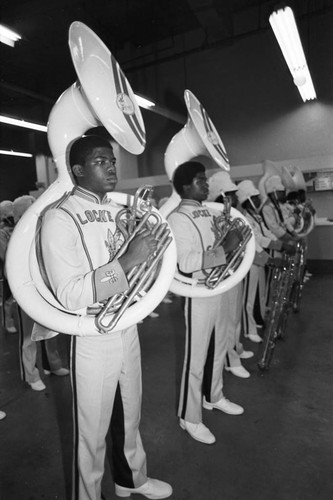 Locke High School students preparing to perform at a LAUSD Band and Drill Team Championship, Los Angeles, 1983